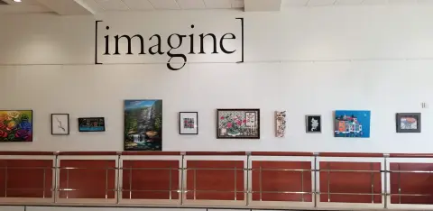 Kristin Sue Kim artworks installed beneath the imagine gallery sign